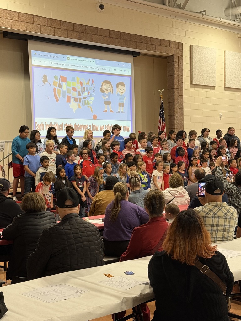 Students preparing to sing for the parents, staff, and Veterans.