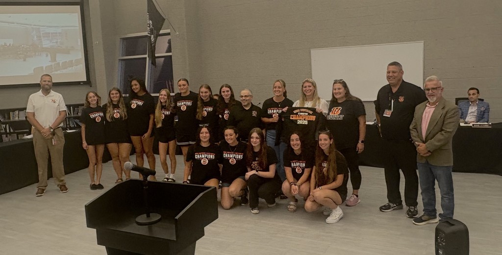 Softball team posing with the Superintendent, Athletic Director, BOE President, and their coaches.