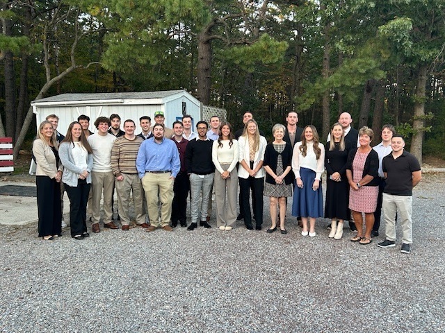 Image of the entire group posing together for a picture. 