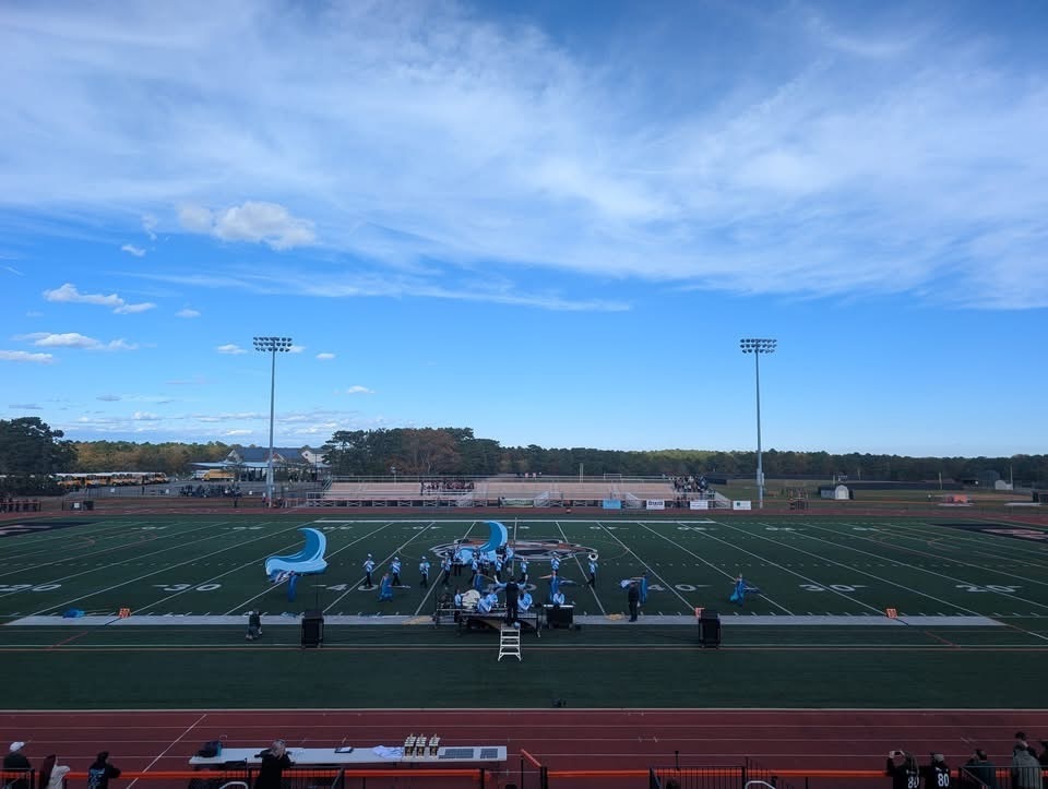 Image of the BHS Marching Bengals performing on the field. 