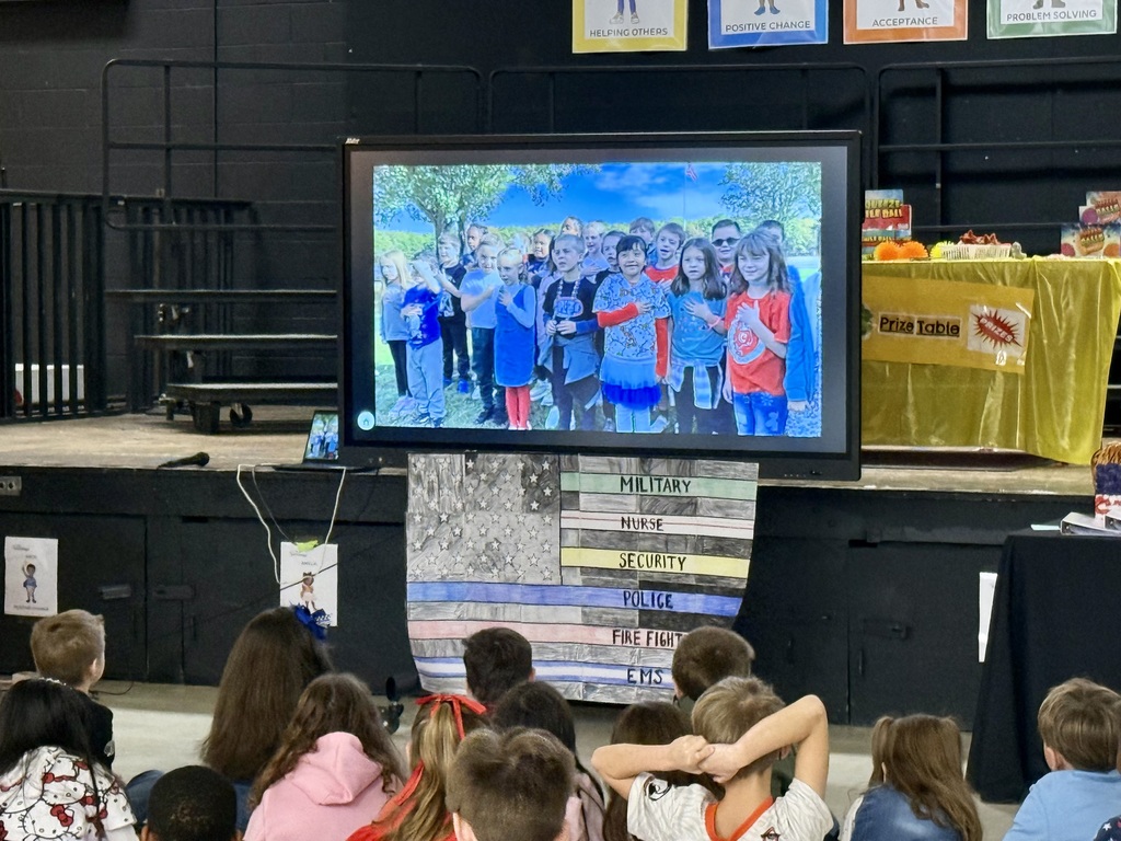 Image of the video presentation on screen where students were reciting the Pledge of Allegiance.