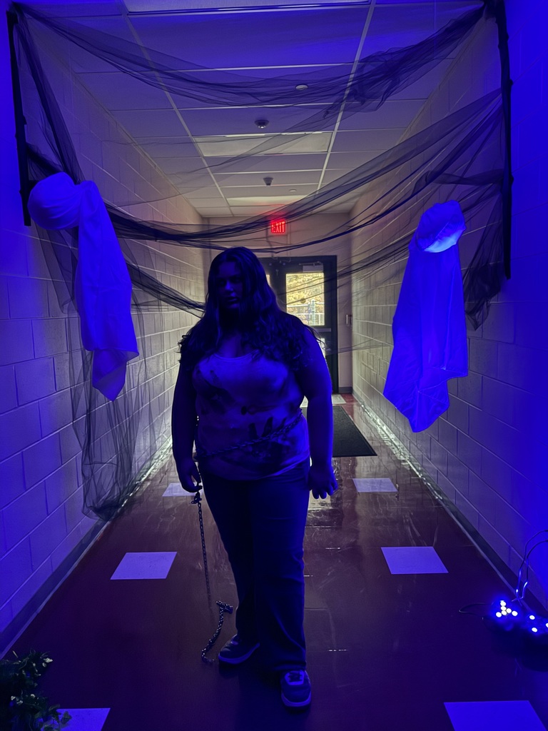 Image of a female student dressed up for the spooky hallway tour. 