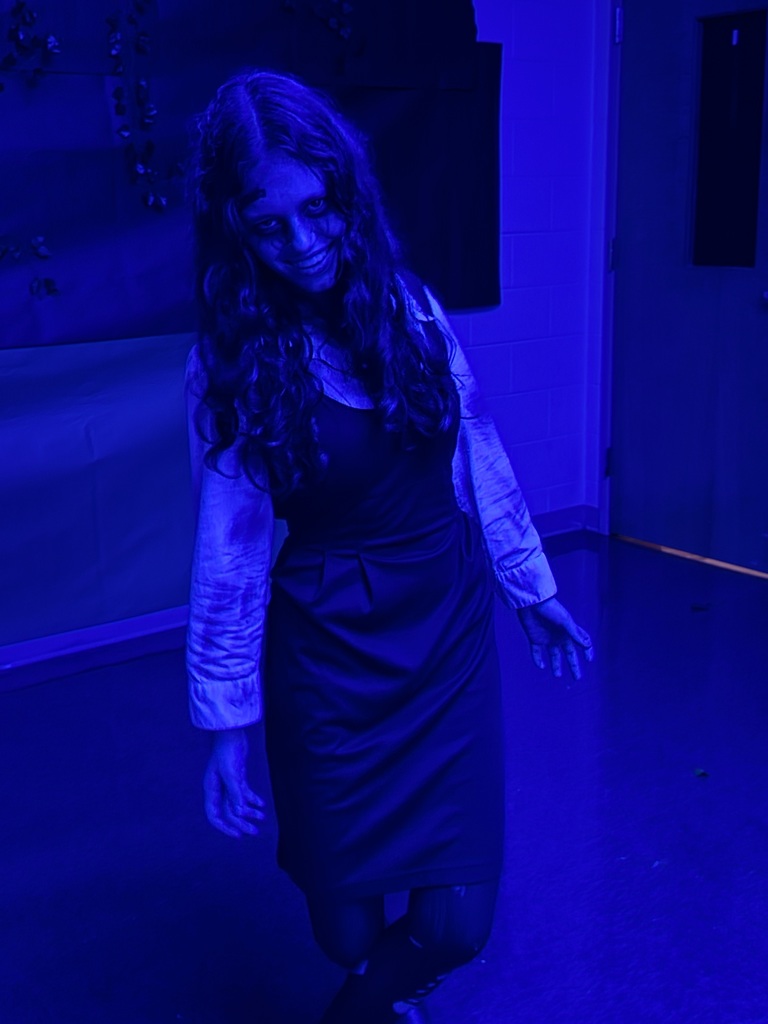 Image of a female student dressed up for the spooky hallway tour. 