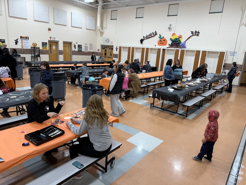 Image of families in the cafeteria where snacks were provided. 