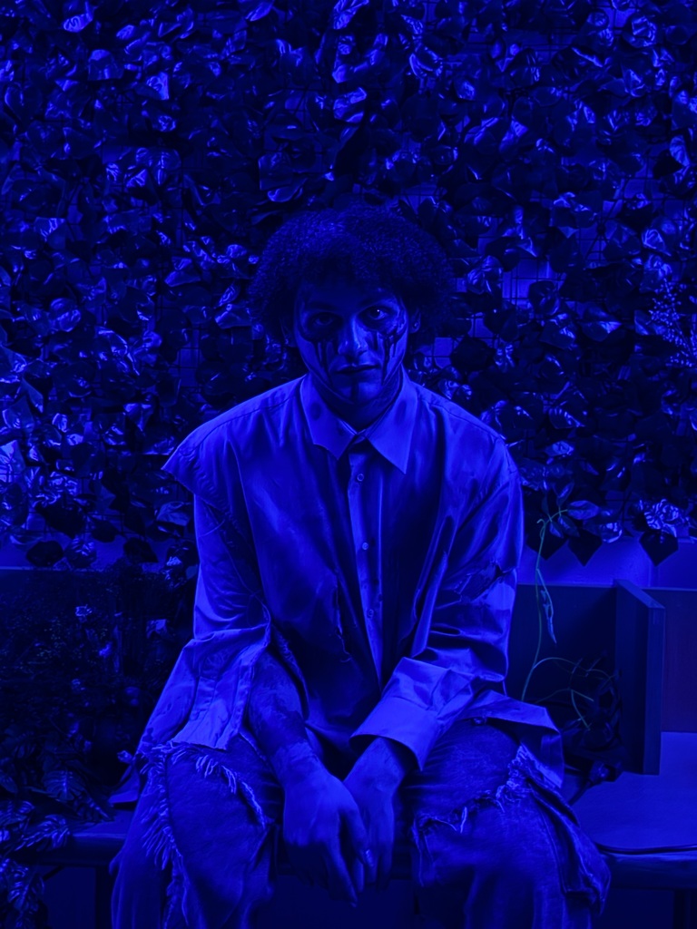 Image of a male student dressed up for the spooky hallway tour. 