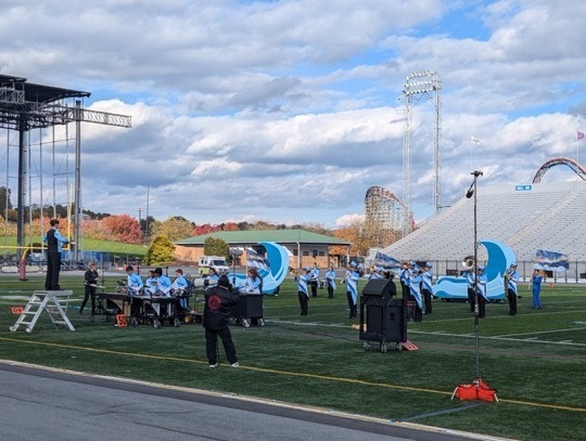 Image of the Marching Bengals performing on the field. 