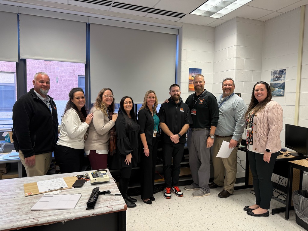 Image of Brendan McCarthy posing with the Superintendent, district and building administrators.  