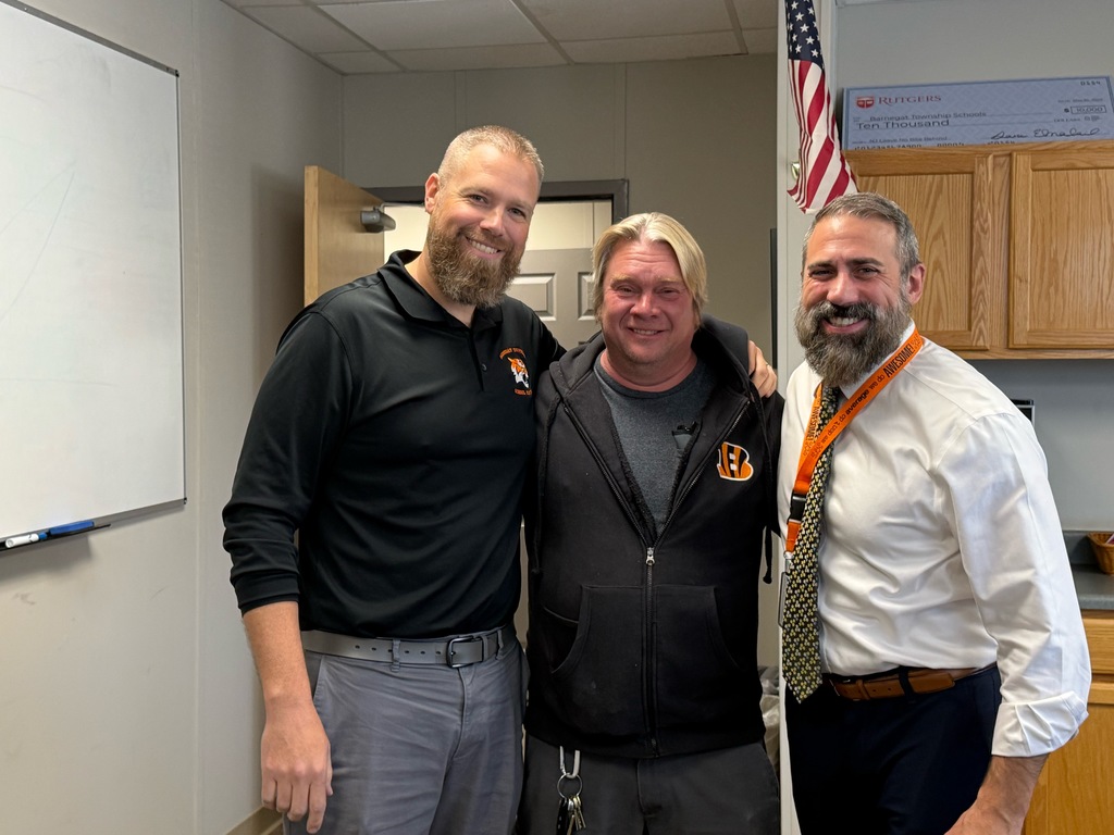 Image of Robert posing with the Superintendent and Director of Curriculum and Instruction. 