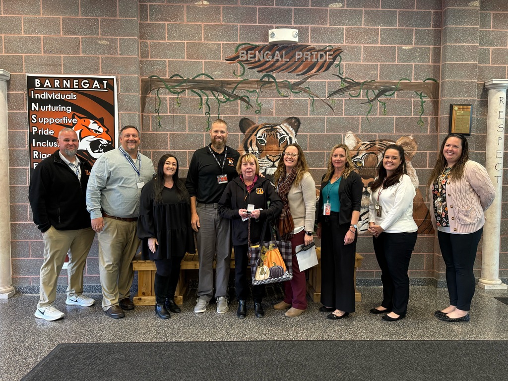 Image of Sharon posing with the Superintendent, district and building administrators. 