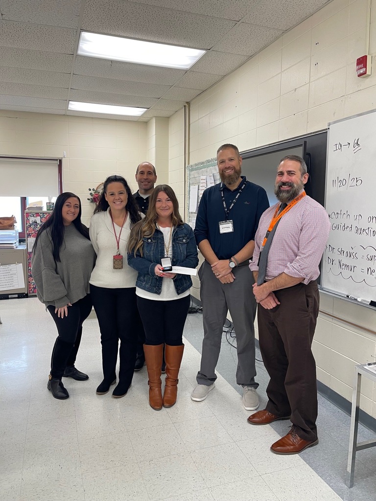 Image of Katie posing with the Superintendent, district and building administrators. 