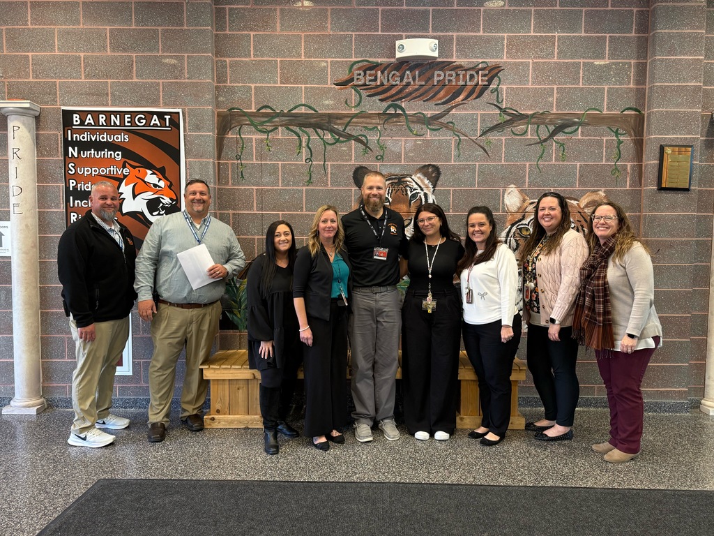 Image of Carissa posing with the Superintendent, district and building administrators. 