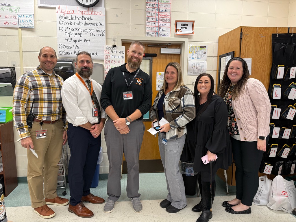 Image of Jennifer posing with the Superintendent, district and building administrators. 
