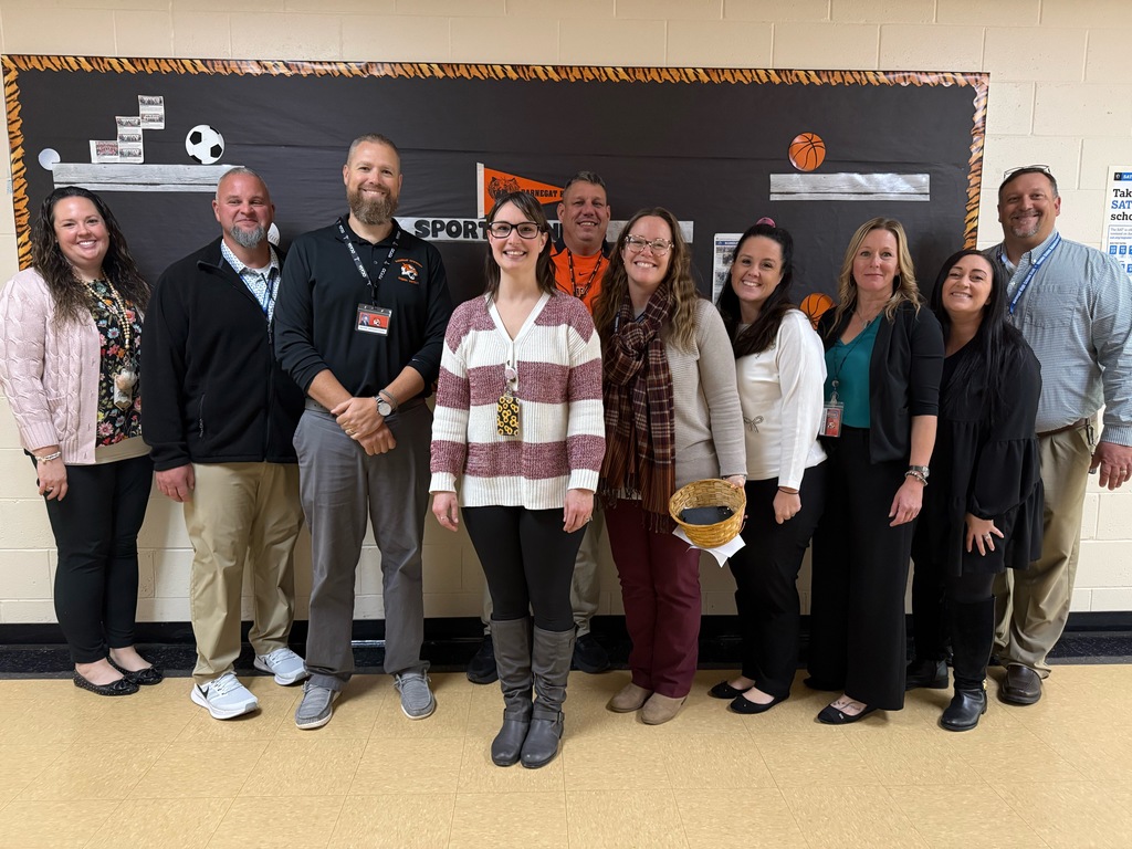 Image of Jessica posing with the Superintendent, district and building administrators. 