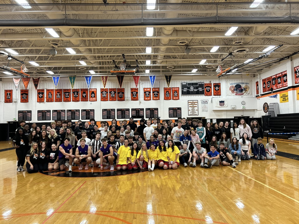 Image of all 27 teams who participated in the tournament posing in the middle of the BHS gym. 