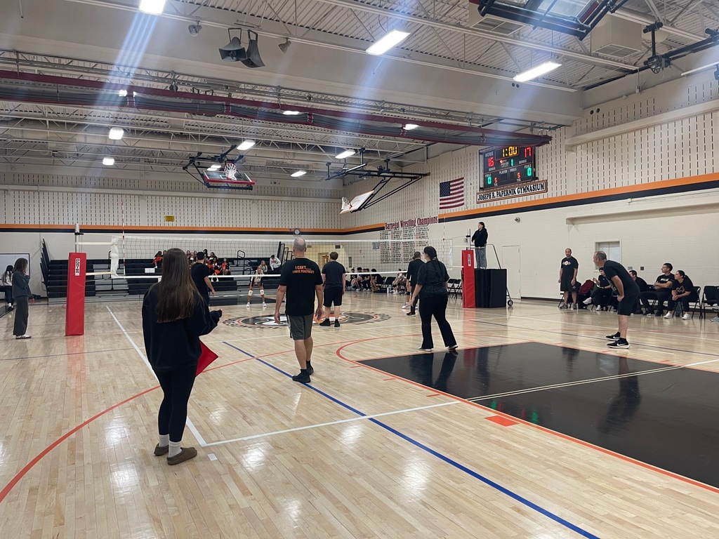 Image of the students and staff playing volleyball in the ROBMS gym. 