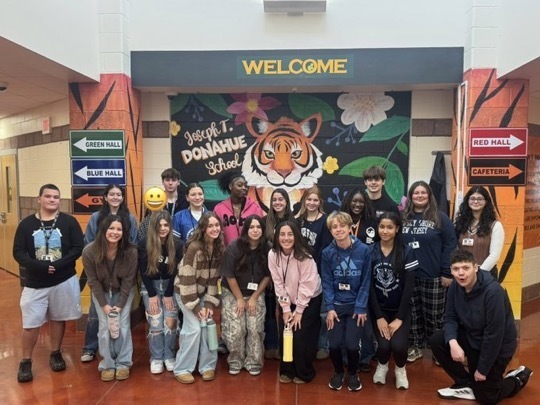 Image of the Dylan's Wings students posing for a picture at the Donahue School. 