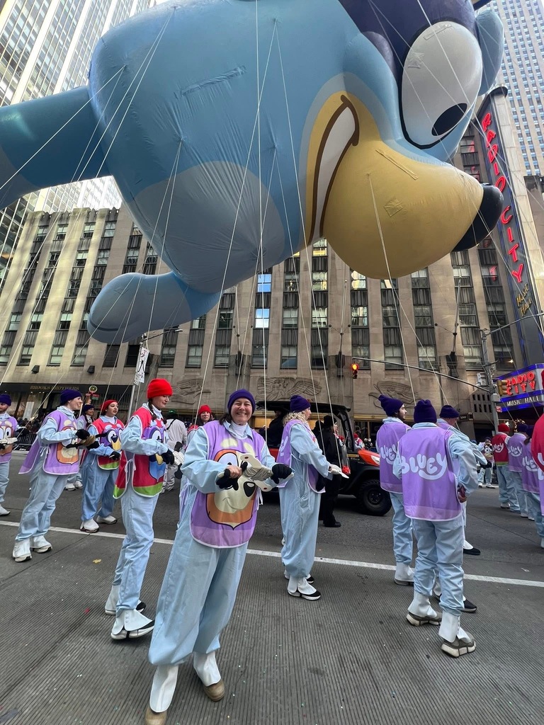 Image of Kerry holding the strings for Bluey in the Macy's Thanksgiving Day Parade. 