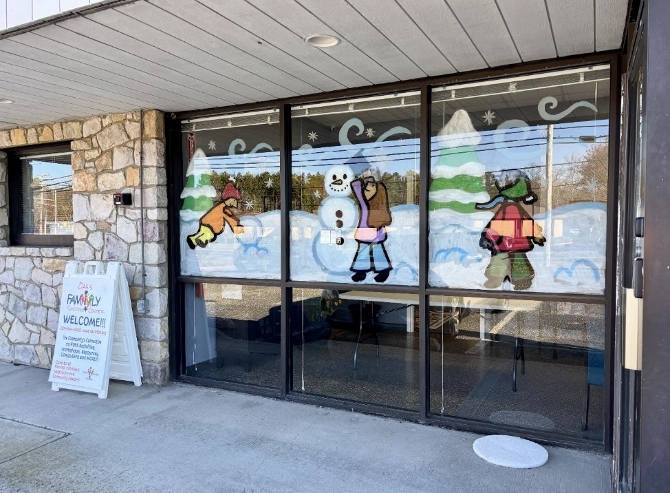 Image of the festive winter scenes painted on the windows. 