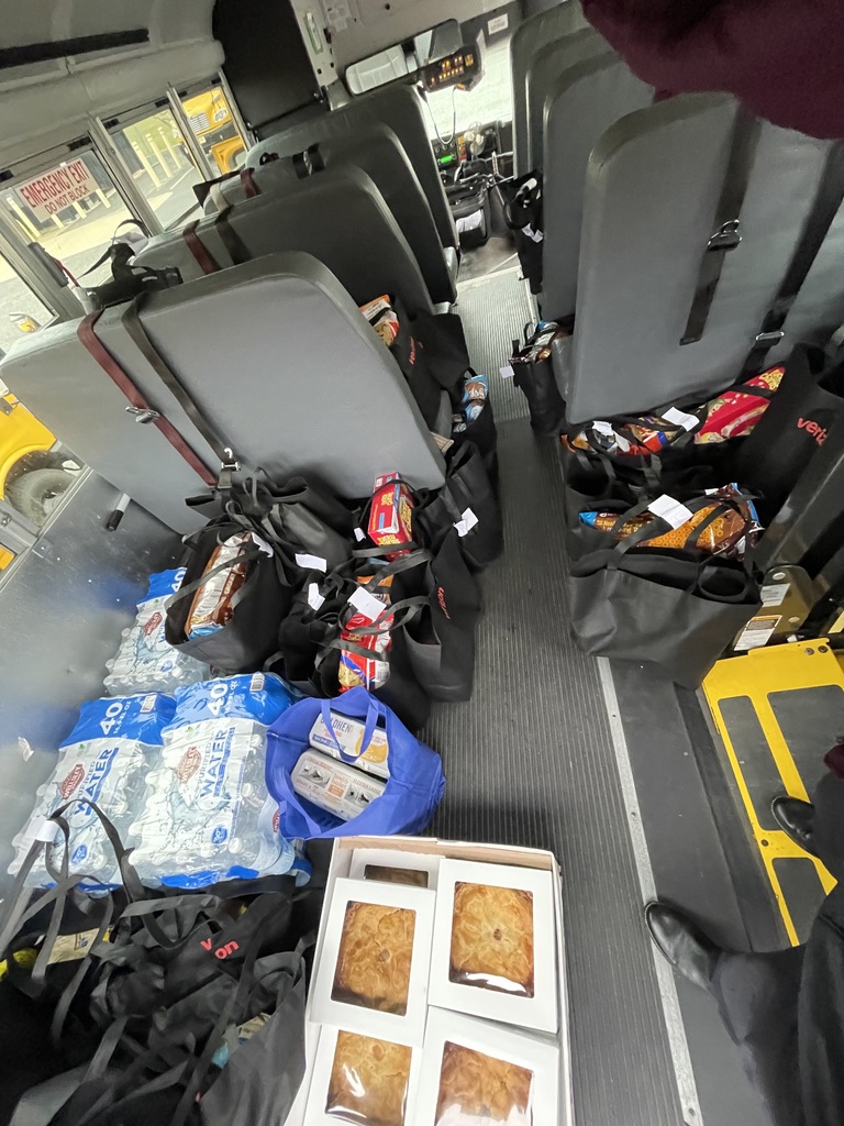 Image of all of the food on the bus before being dropped off for the holiday. 