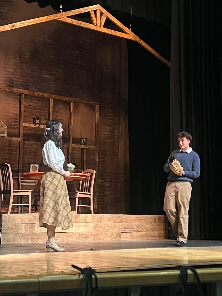 Image of the two actors engaging in a scene. 