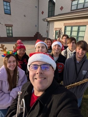 Image of the BHS Tri-M Honors Band taking a selfie. 