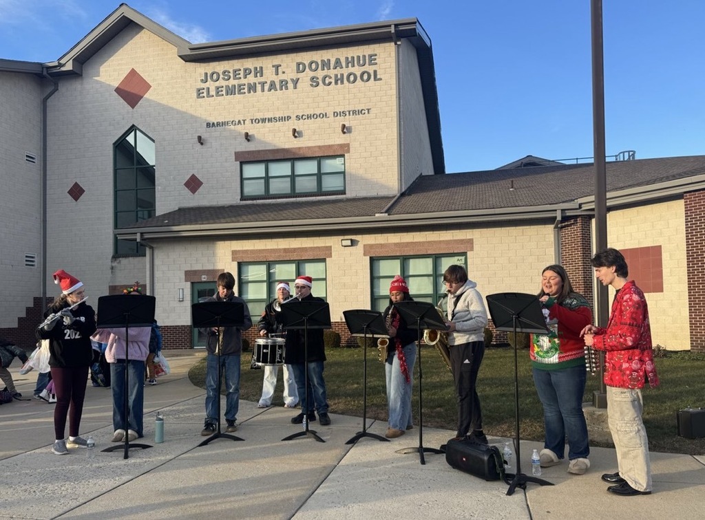 Image of the BHS Tri-M Honors Band performing during dismissal.  