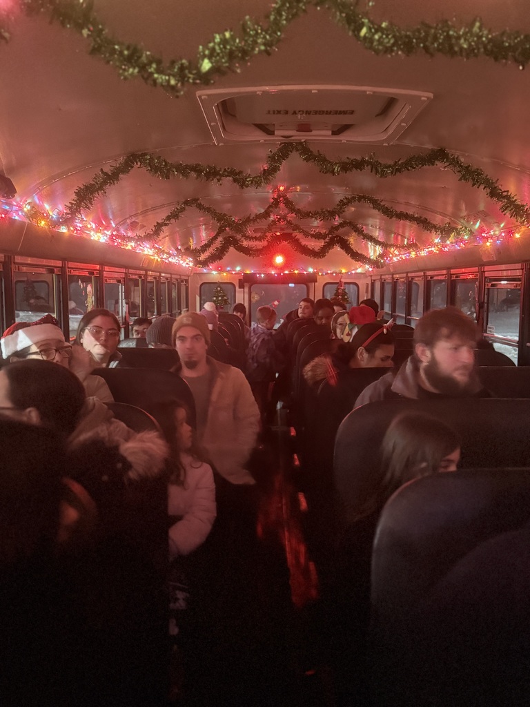 Image of families on the bus waiting for the Holiday Lights Bus Tour to depart. 