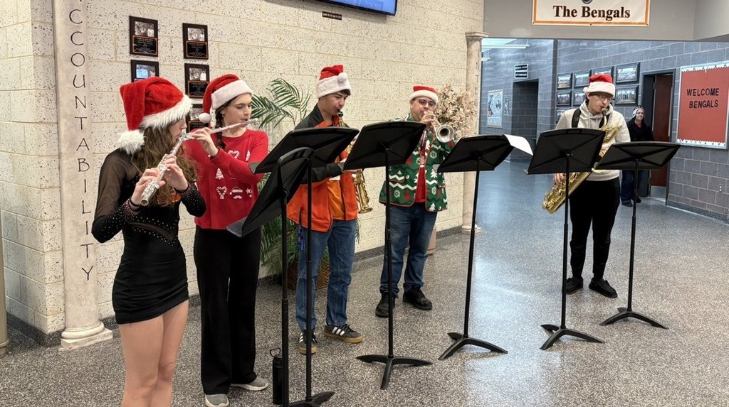 Image of Mr. McGrath and members of the Tri-M Music Honor Society playing a song. 