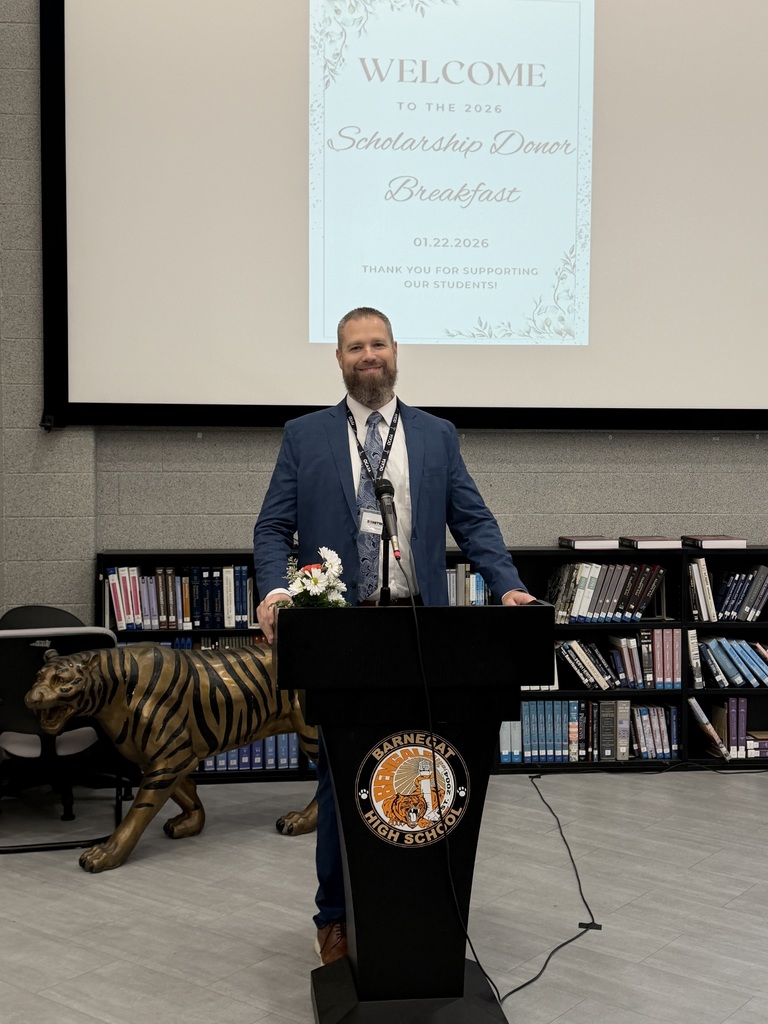 Image of Dr. Latwis, Superintendent,  addressing the audience at the Scholarship Breakfast. 