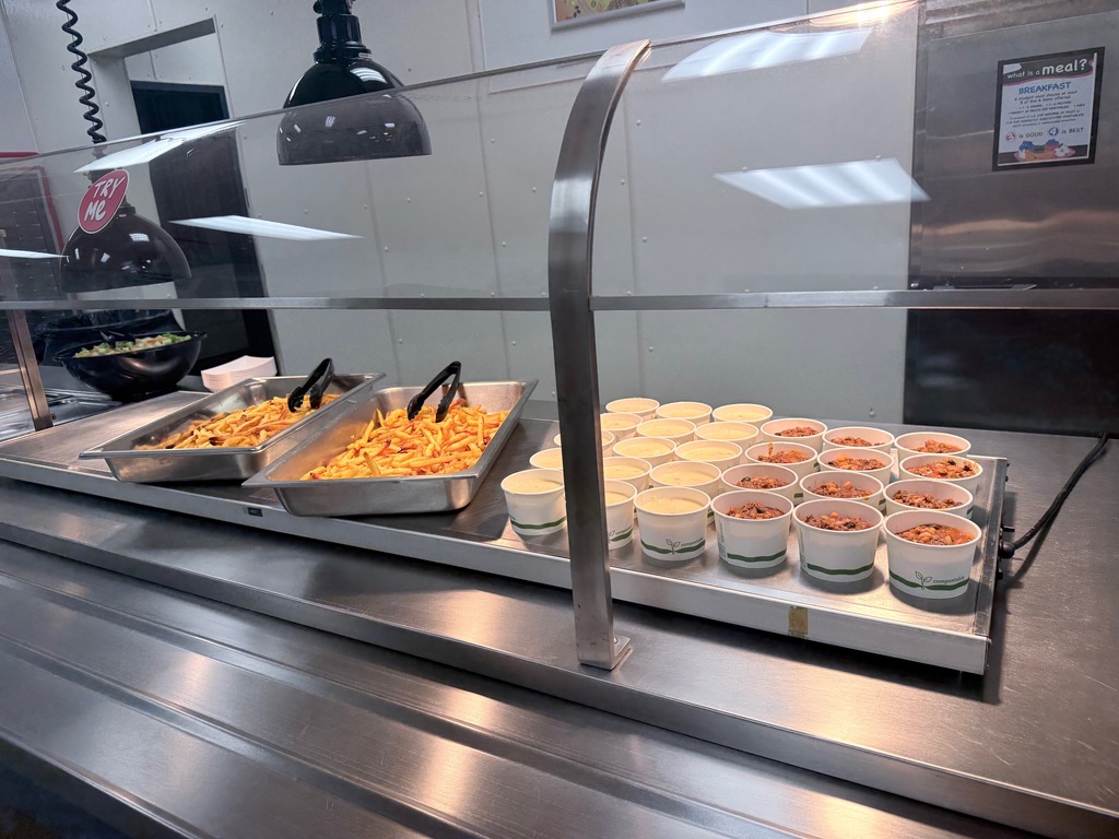 Image of french fries and two different types of soup. 