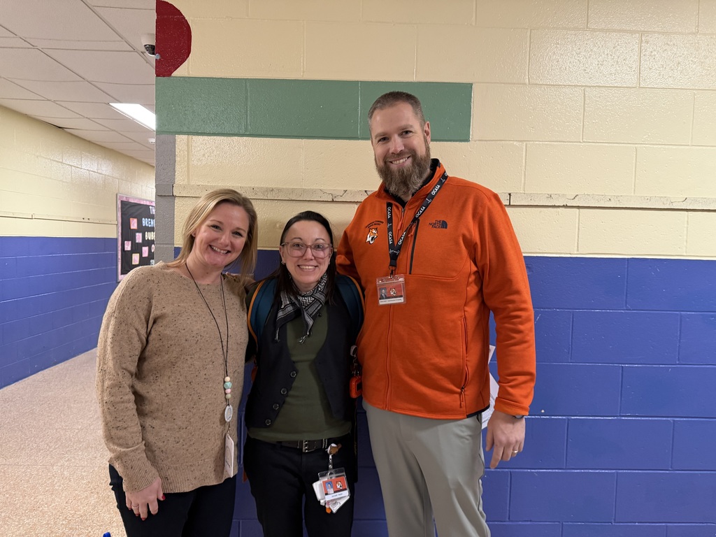 Image of Lisa posing with the Superintendent and Principal. 
