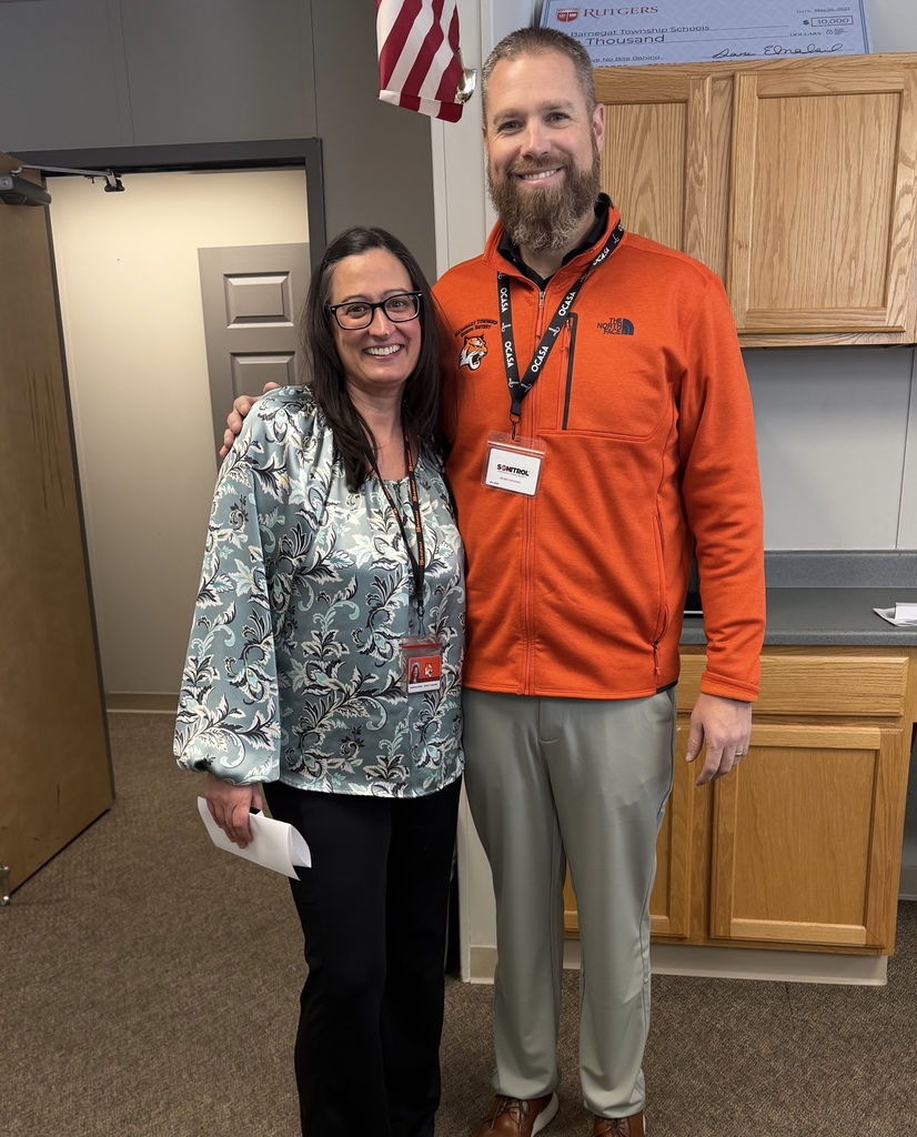 Image of Kimberly posing with the Superintendent.