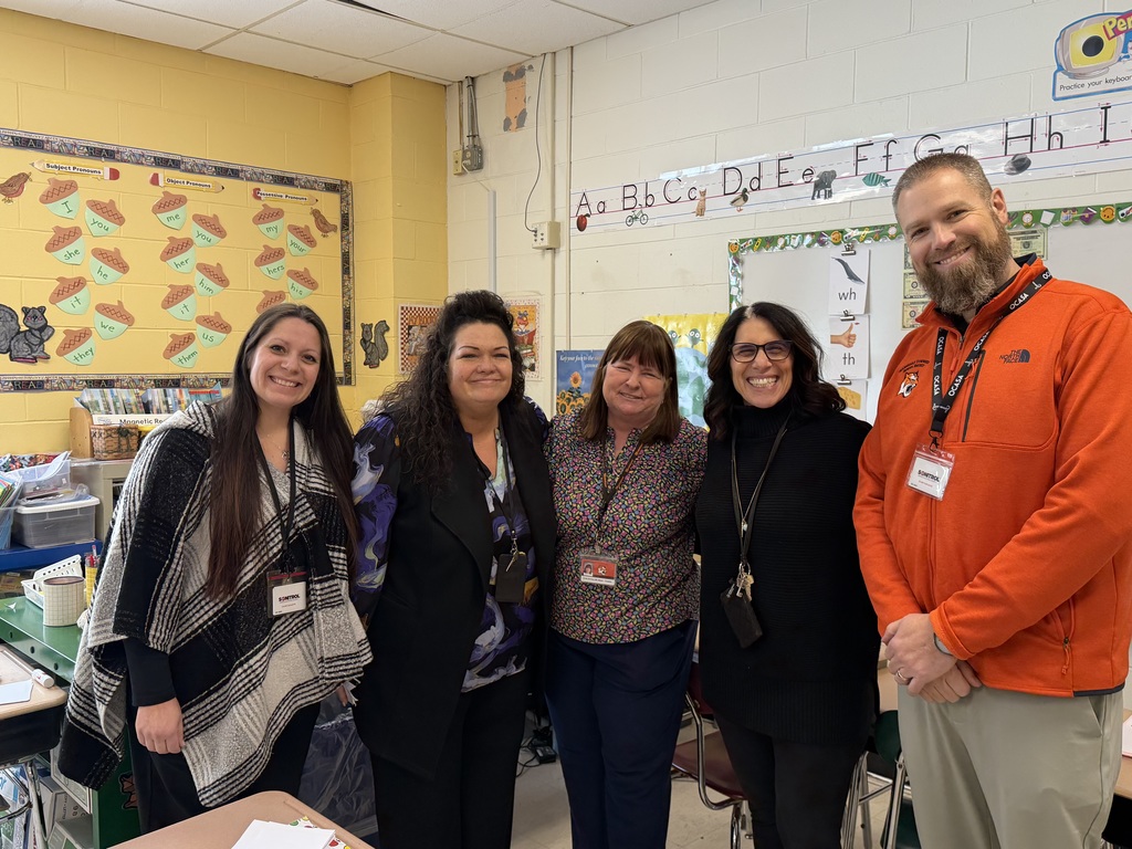 Image of Linda posing with the Superintendent and building administrators.