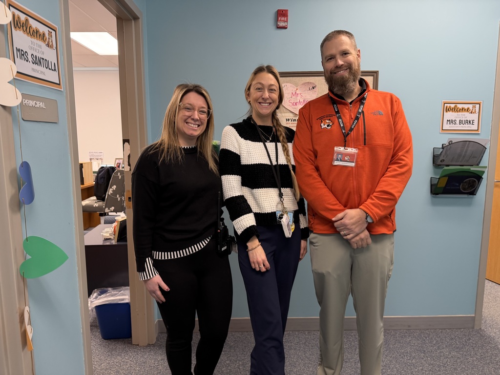 Image of Jennifer posing with the Superintendent and Interim Principal.