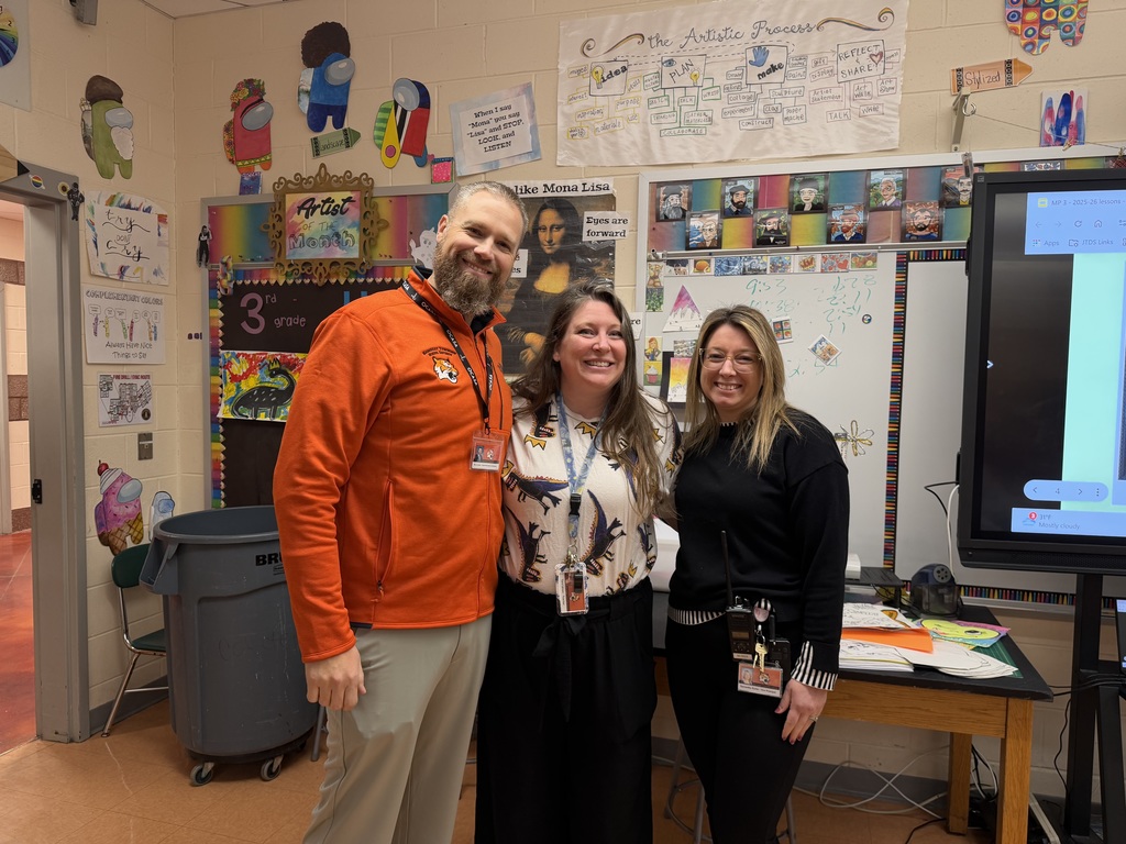 Image of Tara  posing with the Superintendent and Interim Principal.