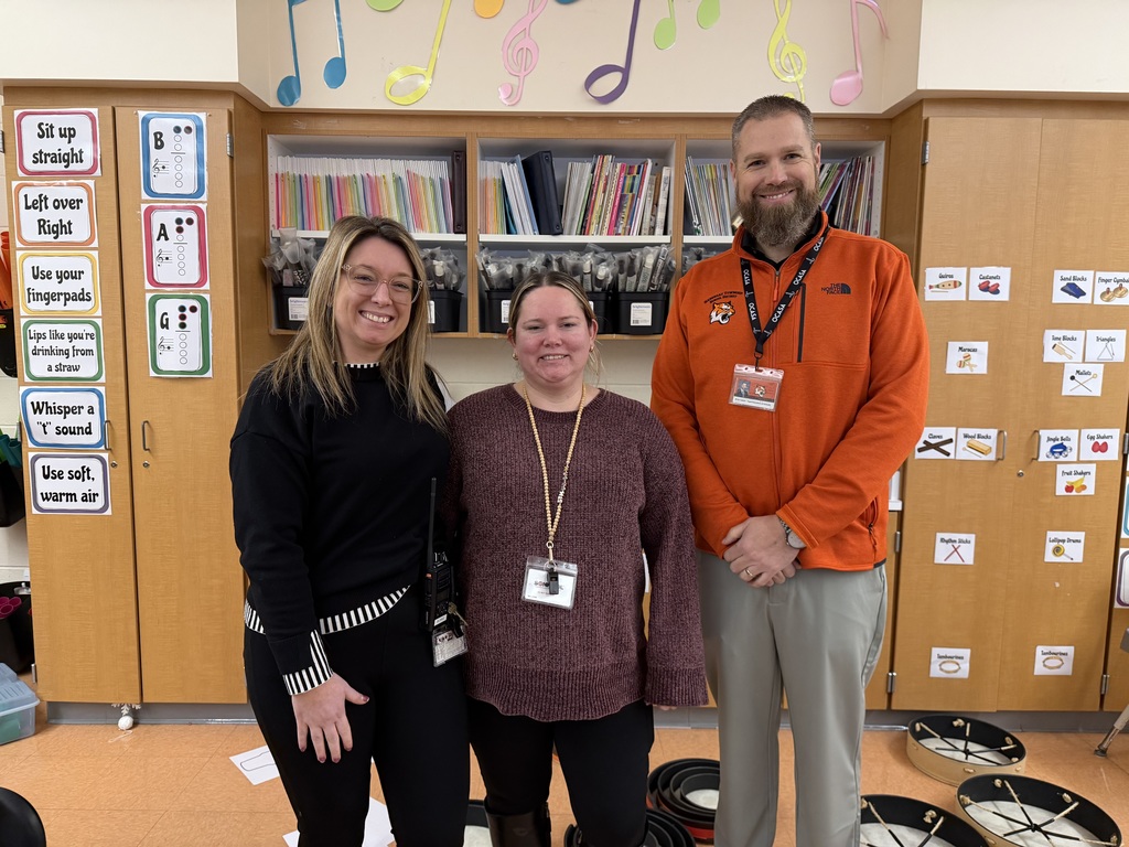 Image of Kacie  posing with the Superintendent and Interim Principal.