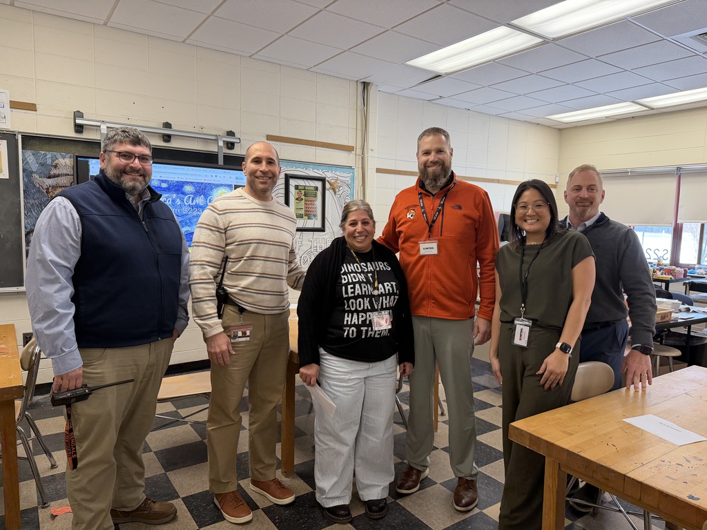Image of Patricia posing with the Superintendent and building administrators.