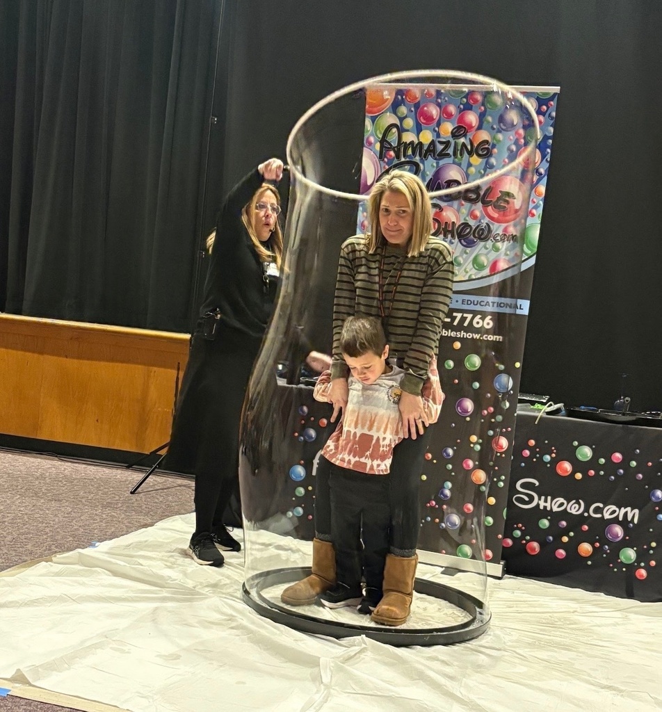 Image of a student and teacher being encased in a bubble by the presenter.