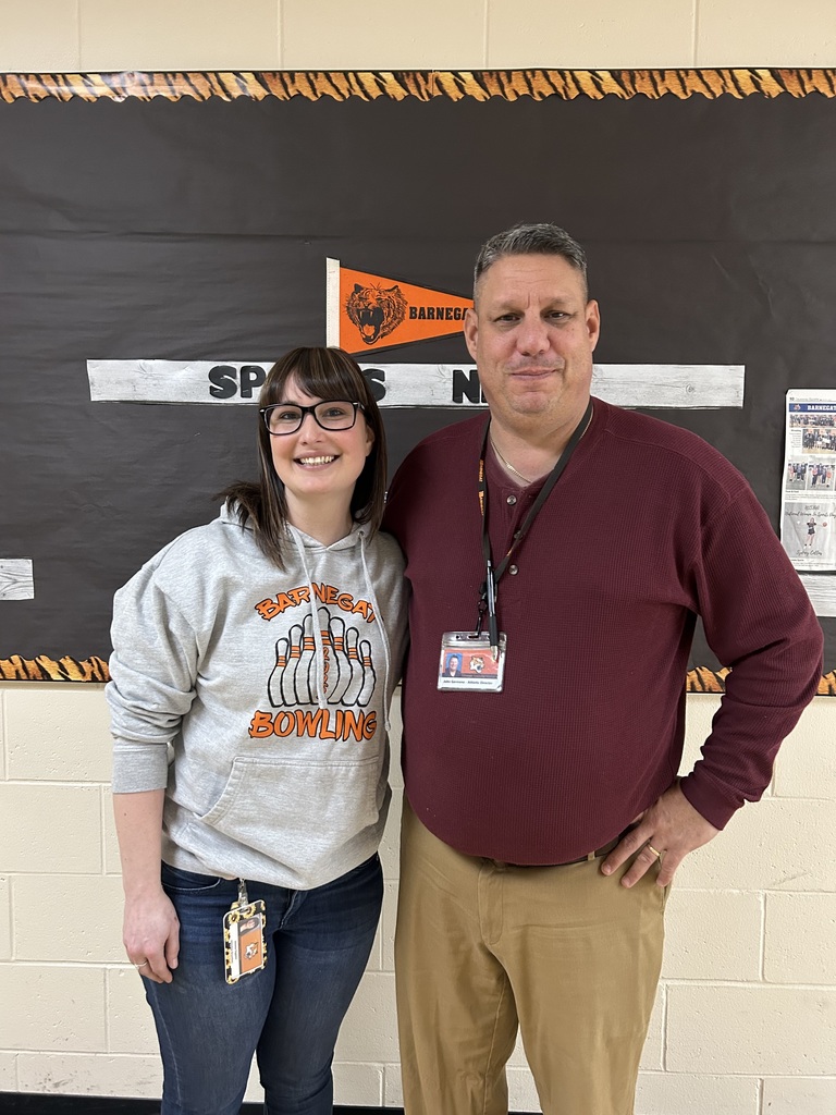 Image of Mrs. Gagnon posing with the District Athletic Director. 