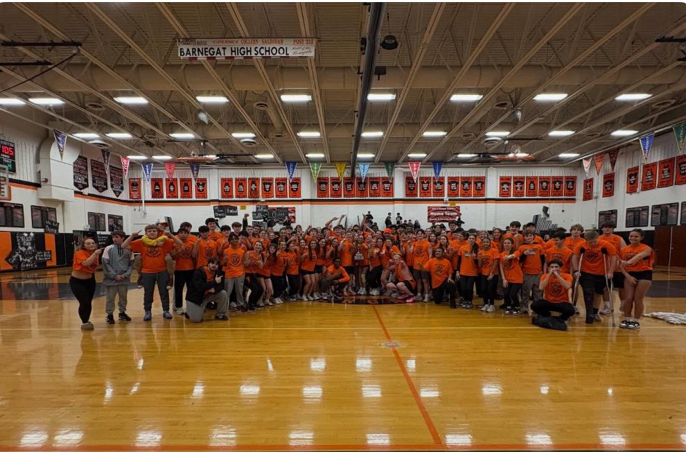 Image of the Orange Team posing together in the main gym after winning the Rumble in the Jungle trophy.  