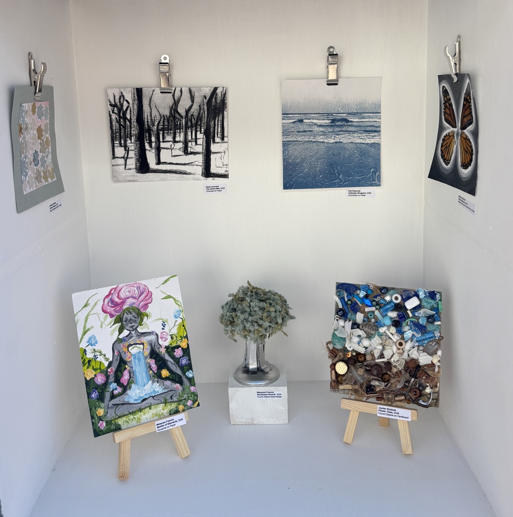 Image of the seven mini art projects displayed in the art gallery.  