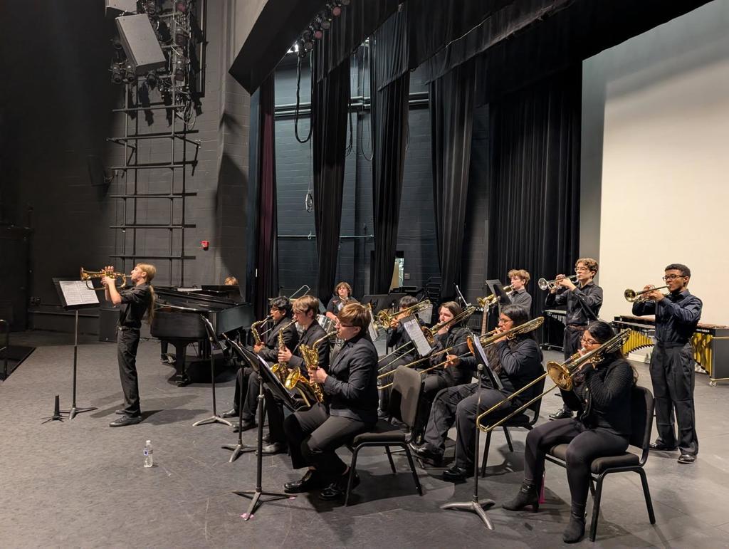 Image of the Jazz Ensemble performing on stage during the Teen Arts Festival. 