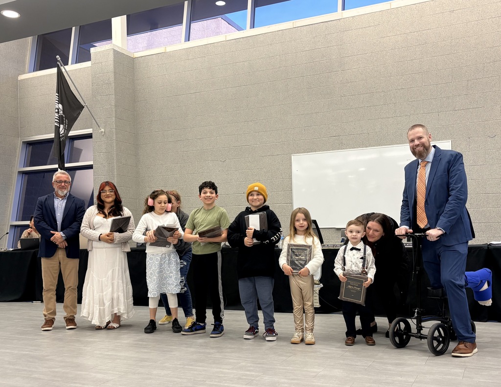Image of the March UPstander award recipients posing with the Superintendent and BOE President. 