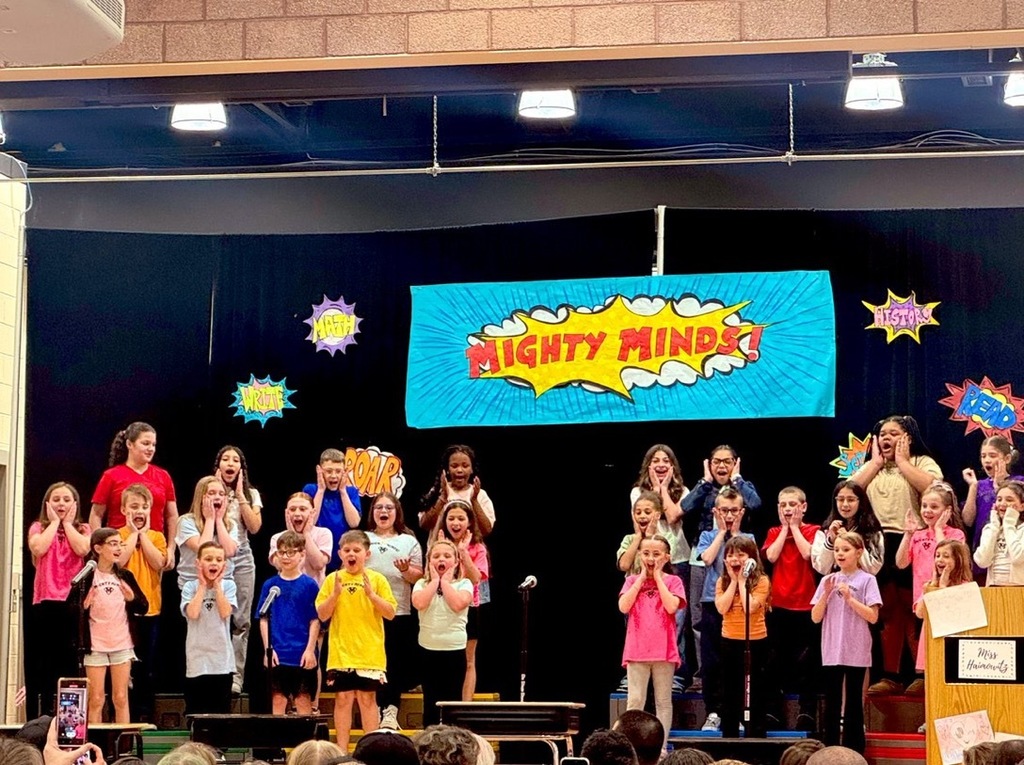 Image of the JTDS Drama Club on stage during their performance. 