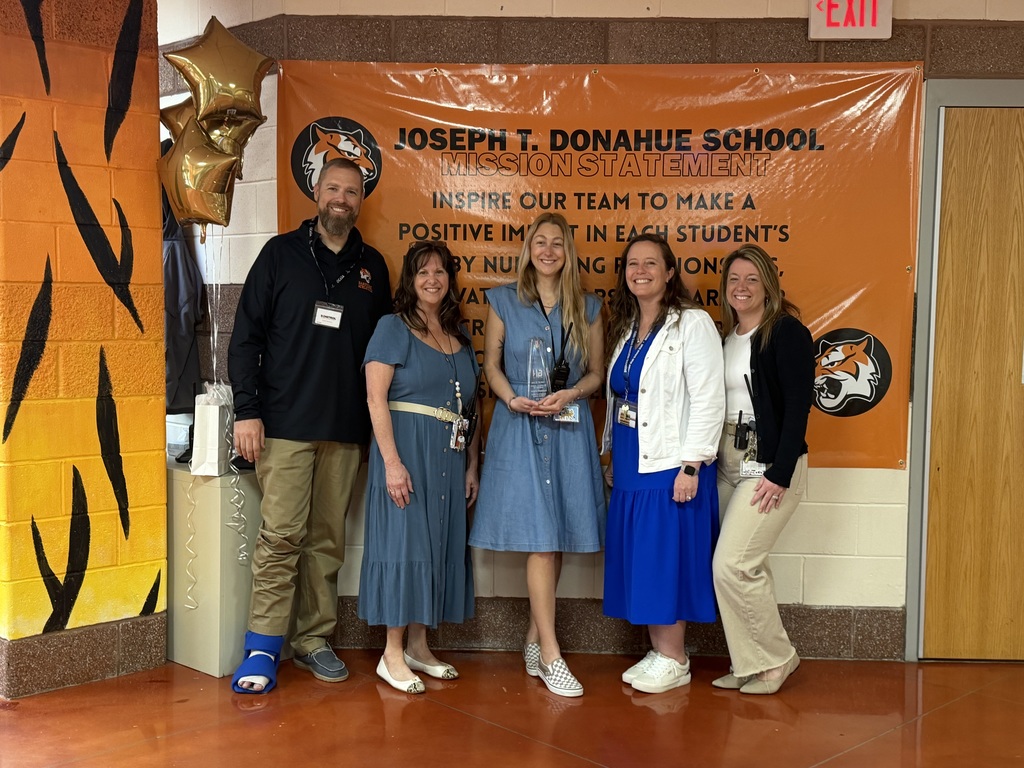 Image of Jennifer posing with the Superintendent, district and building administrators. 