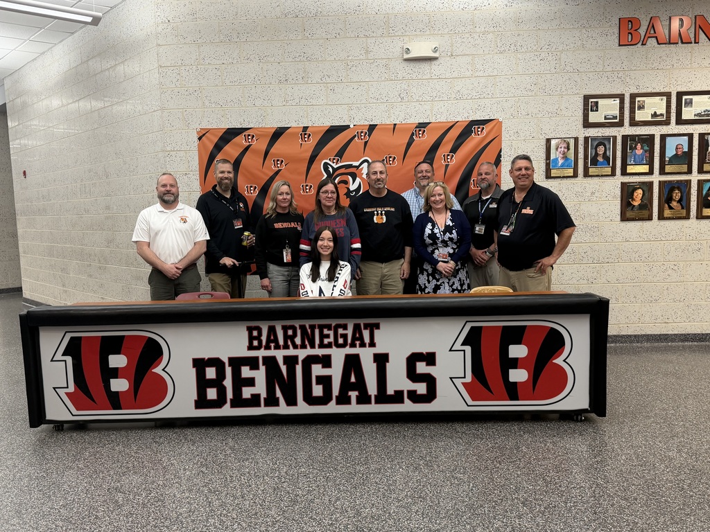 Image of Jamie posing with her coach, family, and building & district administrators. 