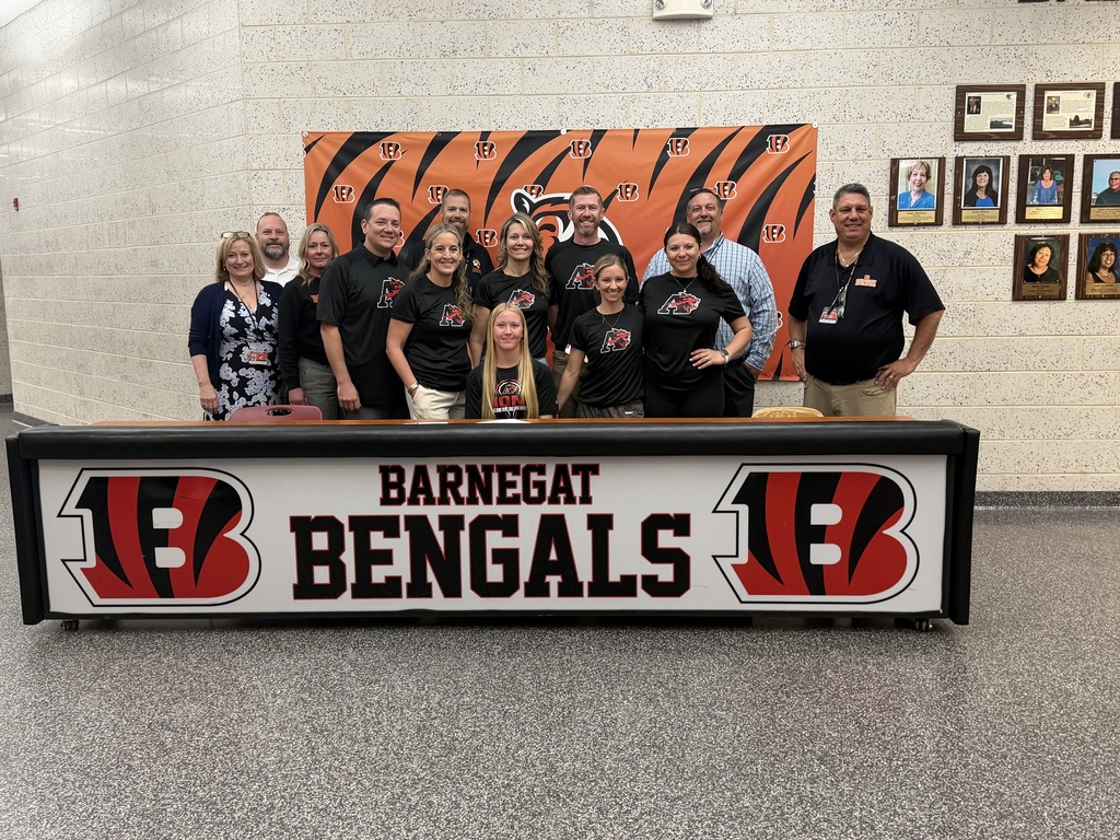 Image of Kylei posing with her coaches, family, and building & district administrators. 