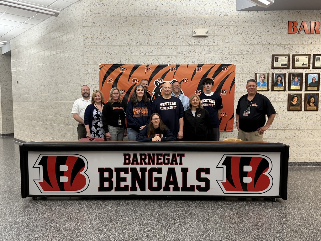 Image of Rachel posing with her coach, family, and building & district administrators. 