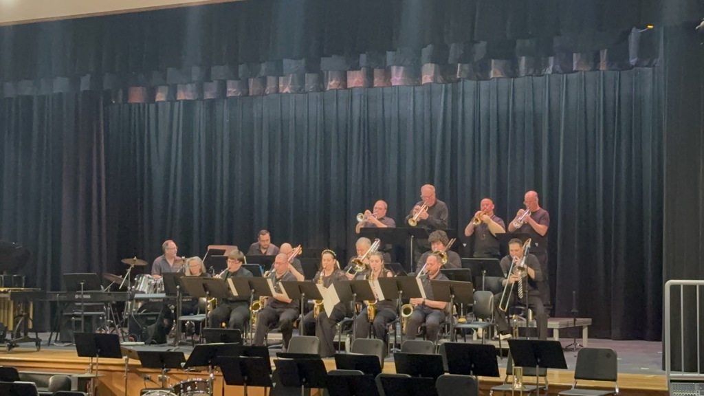 Image of The Brass Tacks Orchestra performing onstage. 