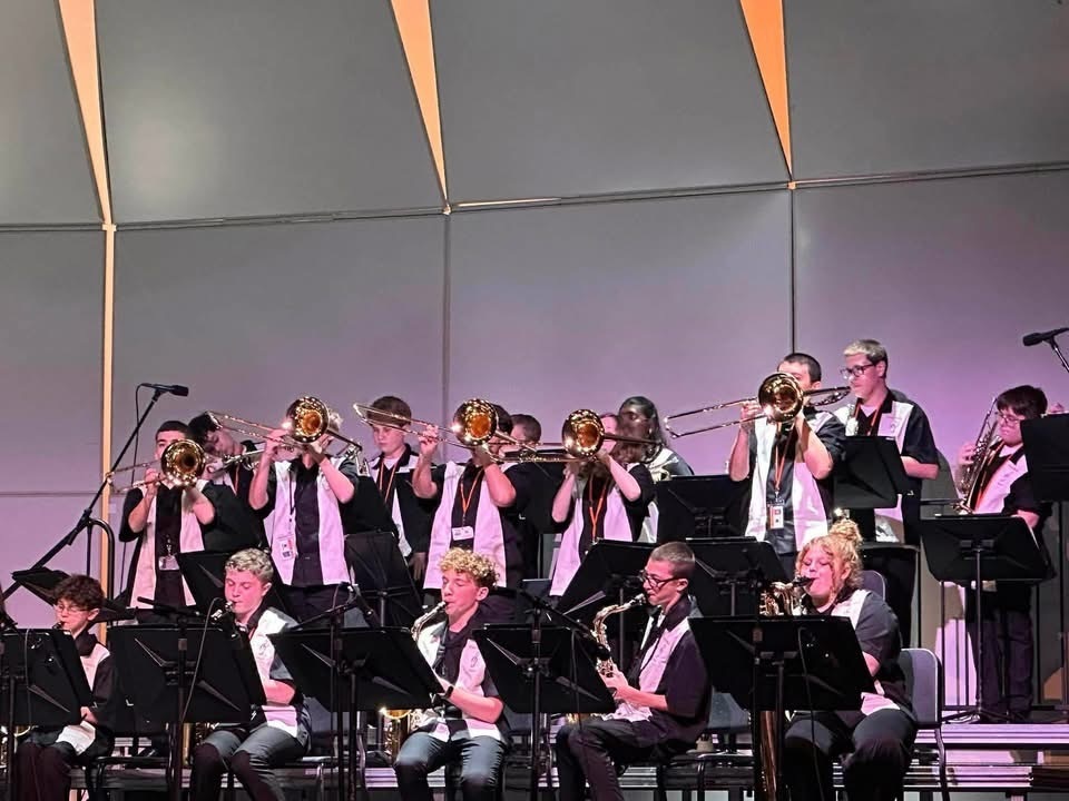 Image of the ROBMS Jazz Ensemble performing on stage at the Mainland Regional Jazz Festival. 